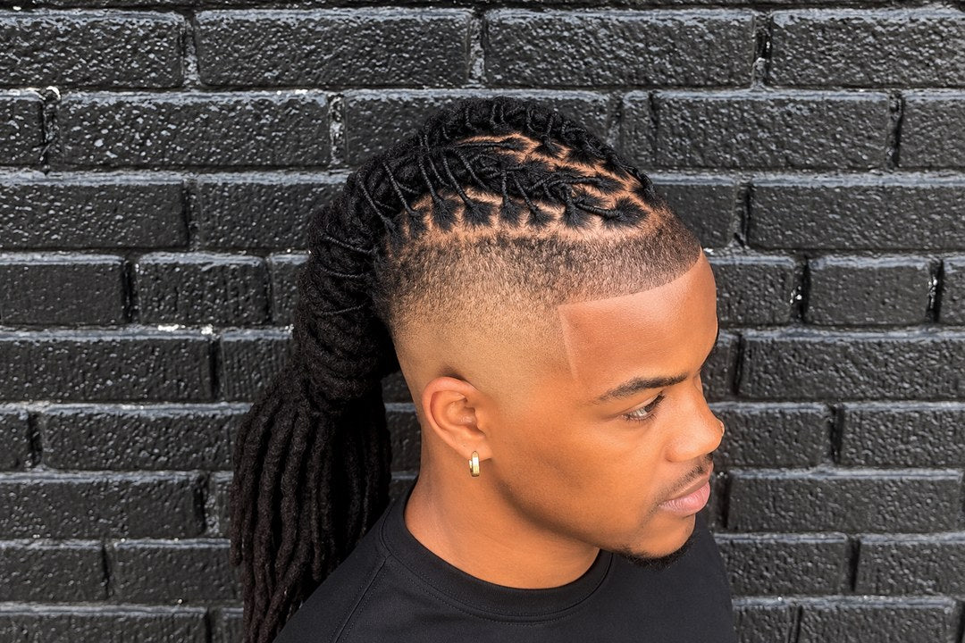 Taper fade with locs pulled back