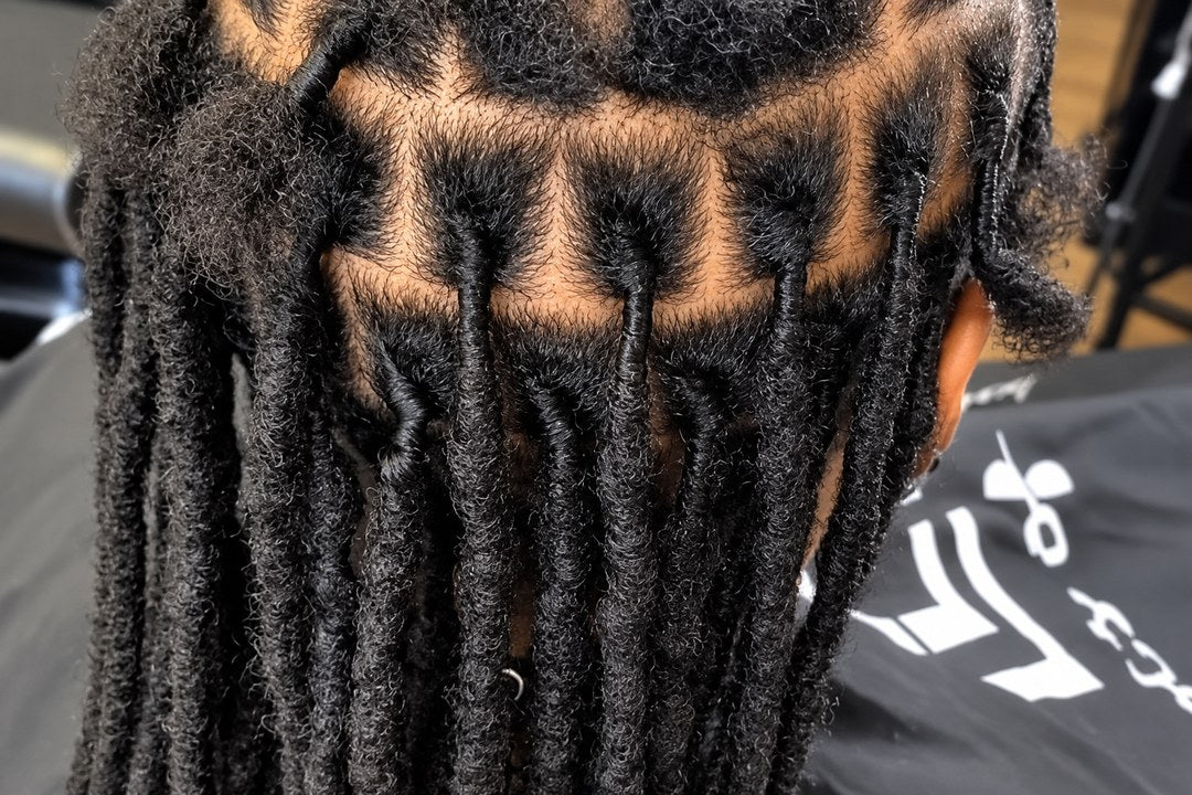 Long loc extensions blended with natural locs